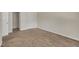 Neutral bedroom featuring carpet flooring and natural light from a nearby window at 1283 Schaub Dr # B, Raleigh, NC 27606