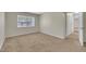 Bedroom features a window, carpet, and neutral colored walls at 1283 Schaub Dr # B, Raleigh, NC 27606