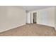 Bedroom featuring neutral colored walls, carpet, and multiple entryways at 1283 Schaub Dr # B, Raleigh, NC 27606