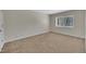Bedroom features a window with blinds, carpet, and neutral walls at 1283 Schaub Dr # B, Raleigh, NC 27606