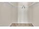 Simple closet with white shelves, rod, neutral walls, and carpet flooring at 1283 Schaub Dr # B, Raleigh, NC 27606