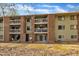Apartment building with exterior stairwell, balconies and green painted brick at 1283 Schaub Dr # B, Raleigh, NC 27606