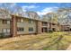 Exterior of apartment building featuring brick accents, green siding, and green lawns at 1283 Schaub Dr # B, Raleigh, NC 27606