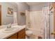 Well-lit bathroom with a shower-tub combination, vanity, and neutral-toned walls at 133 Grassy Rio Ln, Garner, NC 27529