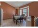 A naturally lit dining room with a view bay window with wood table and chairs at 133 Grassy Rio Ln, Garner, NC 27529