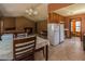 Open concept dining room and kitchen area with tiled floor and lots of natural light at 133 Grassy Rio Ln, Garner, NC 27529