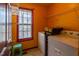 Practical laundry room with washer, dryer, and ample shelving space at 133 Grassy Rio Ln, Garner, NC 27529