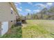 Large, grassy backyard with a privacy fence and a walkout wood deck at 141 Saige Ct, Burlington, NC 27217