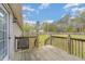 Spacious wood deck overlooking a large, grassy backyard with a privacy fence at 141 Saige Ct, Burlington, NC 27217
