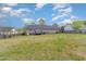 Large, grassy backyard with privacy fencing and a small deck, perfect for outdoor activities at 141 Saige Ct, Burlington, NC 27217