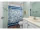 Bathroom featuring a single sink vanity and a shower with a floral curtain at 141 Saige Ct, Burlington, NC 27217
