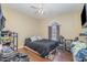 Bedroom with wood floors, a ceiling fan, a window, and coordinating furnishings at 141 Saige Ct, Burlington, NC 27217