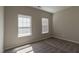 Bedroom featuring neutral walls and carpet along with light from the window at 144 E Victory View Ter # 66, Smithfield, NC 27577