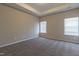 Spacious bedroom featuring recessed lighting, plush carpeting, and two windows at 144 E Victory View Ter # 66, Smithfield, NC 27577