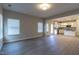 Spacious living room featuring luxury vinyl plank floors and windows with white blinds at 144 E Victory View Ter # 66, Smithfield, NC 27577
