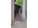 Exterior wooden back porch with stairs leading down to the yard, attached to a brick building at 1505 Harth Dr, Garner, NC 27529