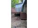 Wooden back porch with stairs leading down to the yard, attached to a painted building at 1505 Harth Dr, Garner, NC 27529