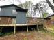 The backyard features a wooden deck overlooking the yard at 1505 Harth Dr, Garner, NC 27529