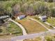 Aerial perspective of the home's large lot and serene setting amongst mature trees in a peaceful community at 188 Hunter Ln, Zebulon, NC 27597