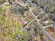 Wide aerial shot showcases the neighborhood and the home's location within a residential community at 188 Hunter Ln, Zebulon, NC 27597