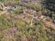 High-angle aerial image displaying the home nestled in a well-established neighborhood with lush, mature trees at 188 Hunter Ln, Zebulon, NC 27597