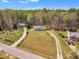 Aerial view of home with a spacious yard surrounded by mature trees, showing its serene location at 188 Hunter Ln, Zebulon, NC 27597