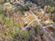This aerial view showcases the neighborhood with mature trees and well-maintained homes at 188 Hunter Ln, Zebulon, NC 27597