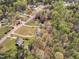 This aerial view displays the neighborhood with mature trees and well-maintained homes at 188 Hunter Ln, Zebulon, NC 27597