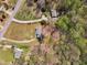 An aerial view displays the property with mature trees and a large yard at 188 Hunter Ln, Zebulon, NC 27597