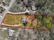 An aerial view displaying the property with mature trees, a large yard, and a blue swimming pool at 188 Hunter Ln, Zebulon, NC 27597