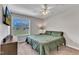 Bedroom with ceiling fan, dresser, and window view at 188 Hunter Ln, Zebulon, NC 27597