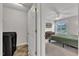 View of bedroom and laundry with carpet and gray walls at 188 Hunter Ln, Zebulon, NC 27597