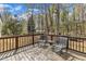Cozy wooden deck with seating offers a great spot to enjoy the outdoors and the surrounding nature at 188 Hunter Ln, Zebulon, NC 27597