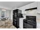 This kitchen features granite countertops, black appliances, and a seamless design, blending style and functionality at 188 Hunter Ln, Zebulon, NC 27597
