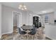 Open concept kitchen with a dining table, black appliances, and neutral tones throughout the space at 188 Hunter Ln, Zebulon, NC 27597