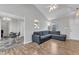 Open-concept living room with adjacent dining area and view of kitchen, features modern decor and ample natural light at 188 Hunter Ln, Zebulon, NC 27597