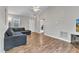 Spacious living area featuring vaulted ceilings, modern flooring, and a neutral color palette with a large gray sofa at 188 Hunter Ln, Zebulon, NC 27597
