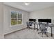 Functional home office space with two workstations and a view from the window at 188 Hunter Ln, Zebulon, NC 27597