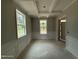 Dining room featuring decorative ceiling, wainscoting and large windows, offering a bright and inviting atmosphere at 1945 Cranes Creek Rd, Cameron, NC 28326