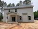 Rear view of home with lots of windows and covered porch at 1945 Cranes Creek Rd, Cameron, NC 28326