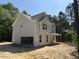 Two-story house with attached garage, gray siding and a covered front porch, still in construction at 1945 Cranes Creek Rd, Cameron, NC 28326