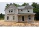 Charming two-story home with light gray siding and inviting front porch details at 1945 Cranes Creek Rd, Cameron, NC 28326
