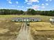 Aerial view of a home on a vast lot with driveway and mature trees at 20 Chaney Ln, Louisburg, NC 27549
