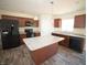 Modern kitchen boasts stainless steel appliances, granite counters, and center island at 20 Chaney Ln, Louisburg, NC 27549