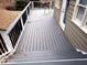 Spacious back deck area with black metal railings and stairs leading to the ground at 2000 Mountain Laurel Dr, Clayton, NC 27527