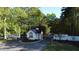 Gated community entrance framed by lush trees, providing a private and secure entry at 2000 Mountain Laurel Dr, Clayton, NC 27527