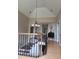 Elegant hallway featuring hardwood floors, a decorative chandelier, and access to other rooms, creating a welcoming atmosphere at 2000 Mountain Laurel Dr, Clayton, NC 27527