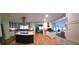 Open concept kitchen with a large island, stainless steel appliances, and hardwood flooring at 2000 Mountain Laurel Dr, Clayton, NC 27527