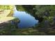 Scenic lake view with mature trees, walking path and tranquil setting at 2000 Mountain Laurel Dr, Clayton, NC 27527