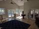 Open living space with tile floors, a high ceiling, and views of the outdoor deck at 2000 Mountain Laurel Dr, Clayton, NC 27527